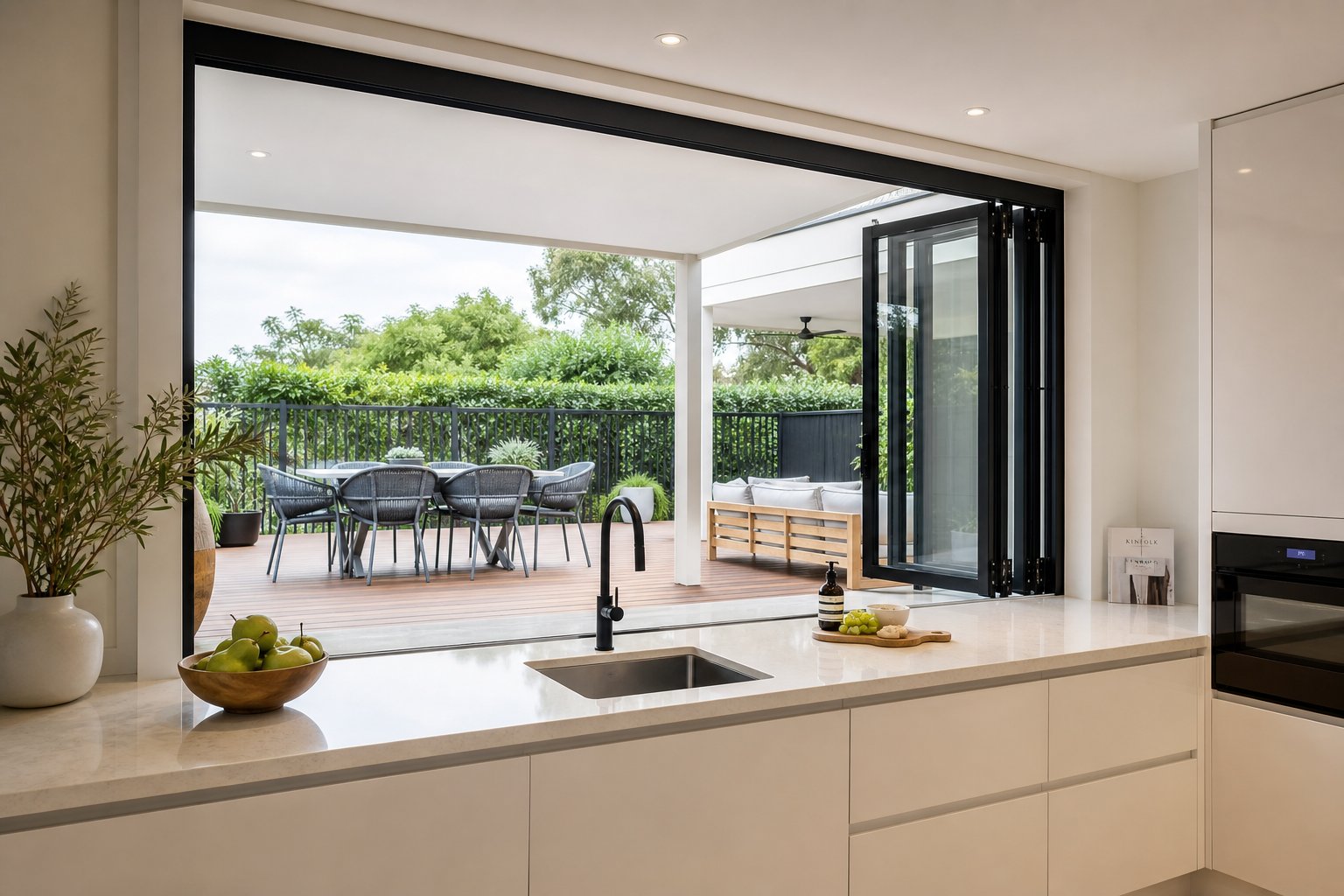 a bifold servery window transforms a sydney kitchen into an open air entertaining hub