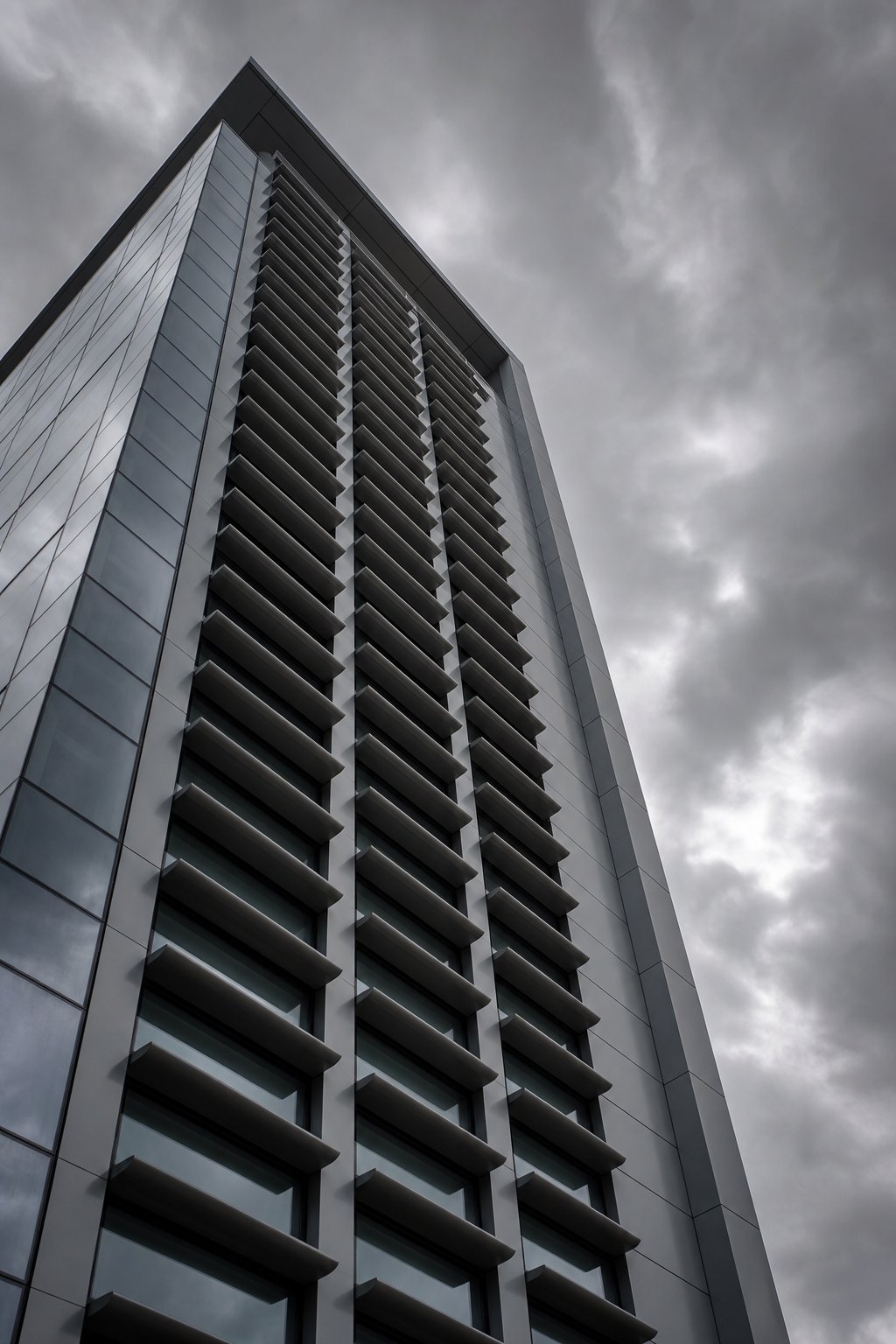 heavy duty aerofoil aluminium louvers on a high rise facade engineered for extreme wind load resistance