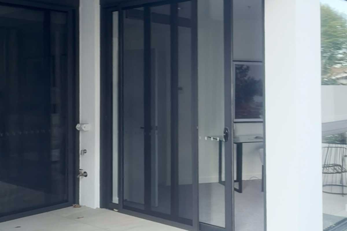 multi point locking hardware on an aluminium sliding sash window showing robust security engagement points