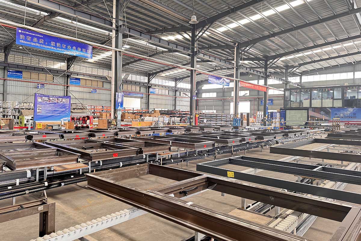 inside an aluminium window fabrication facility where precision cut profiles are assembled into finished frames