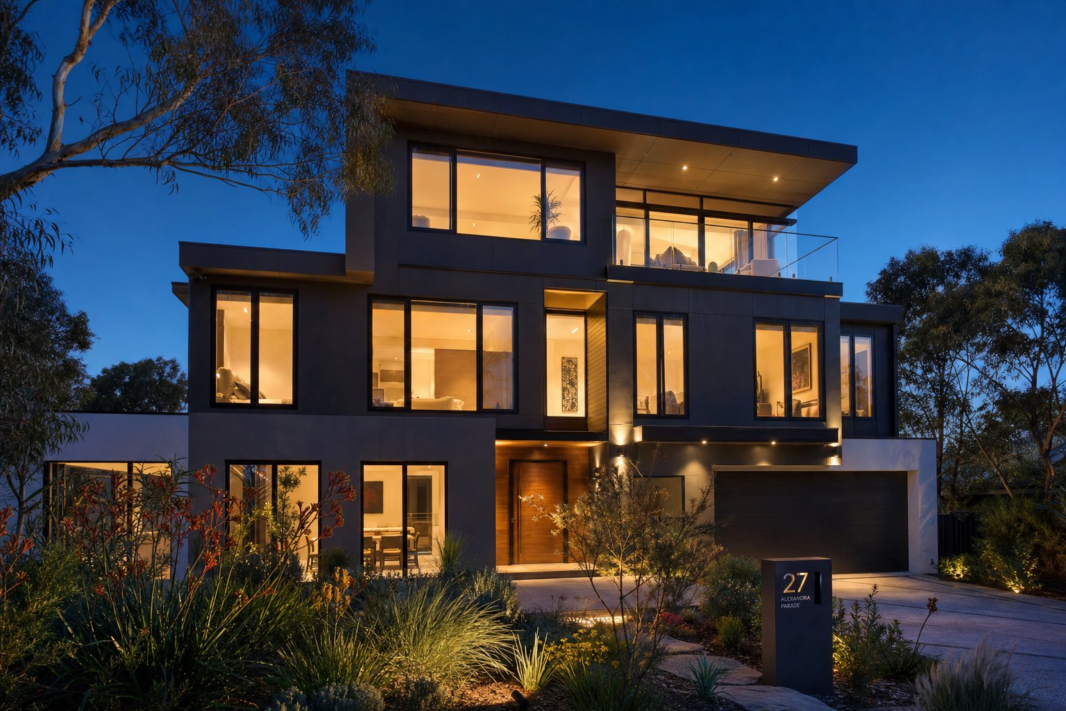 modern australian home featuring multiple aluminium casement window configurations illuminated at dusk