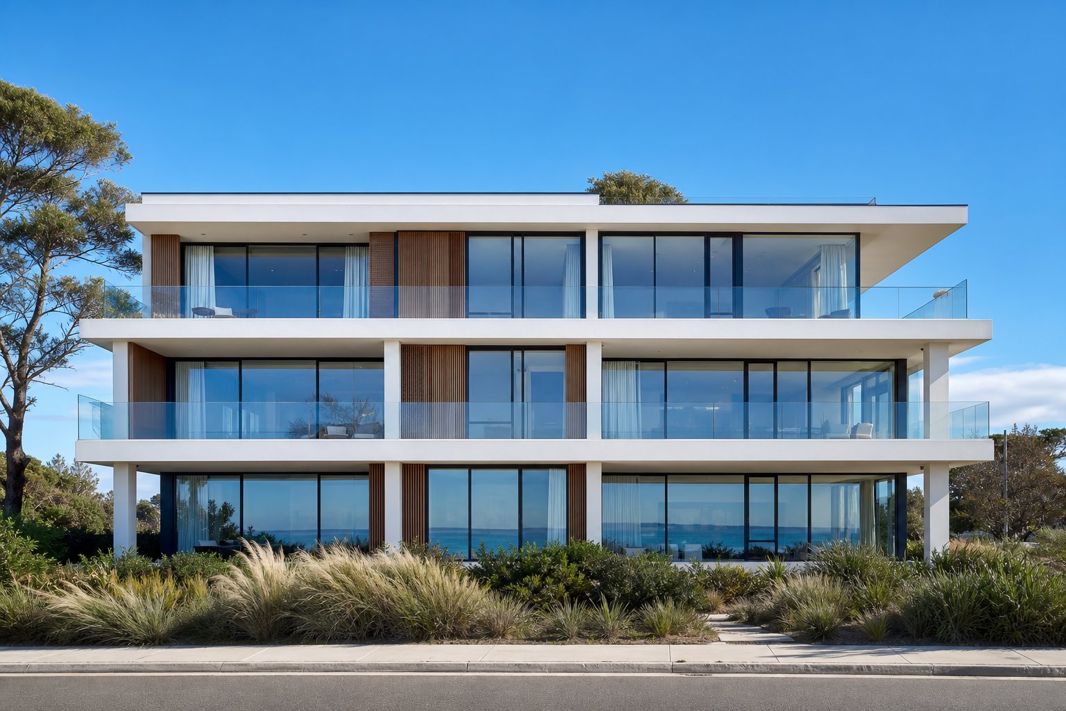 multi storey coastal australian development featuring standardised aluminium windows and sliding doors across every unit
