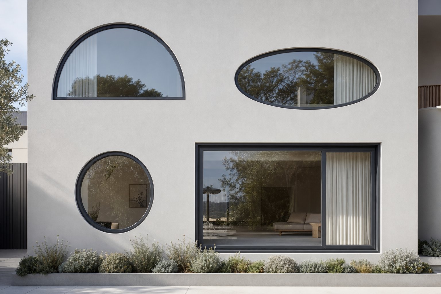 variety of curved aluminium window frame designs including semicircular circular and elliptical profiles on a contemporary facade