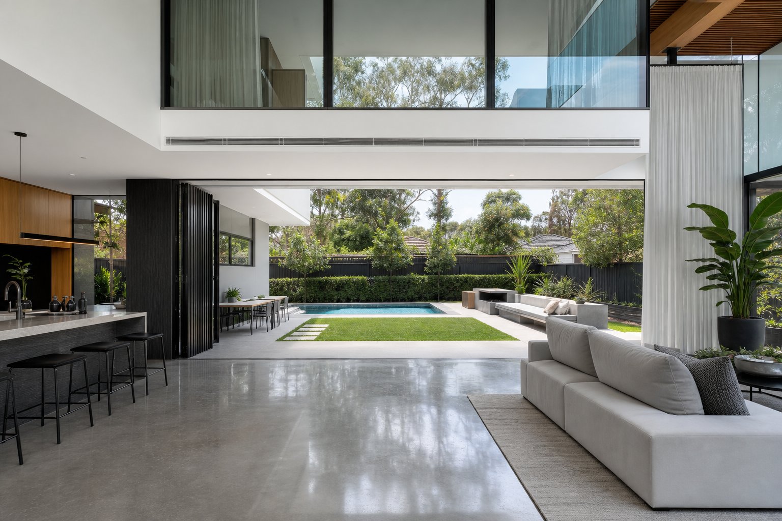 panel track blinds paired with wide aluminium bifold doors in a contemporary australian living space