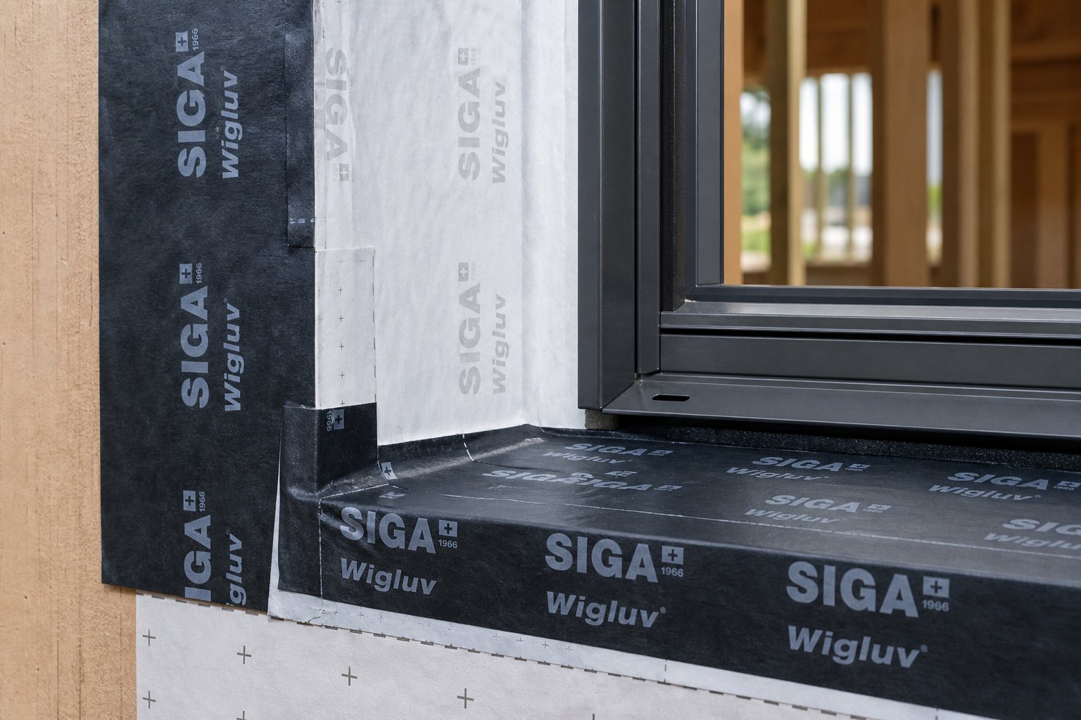 shingled flashing membrane layers at a window jamb ready for aluminium frame installation
