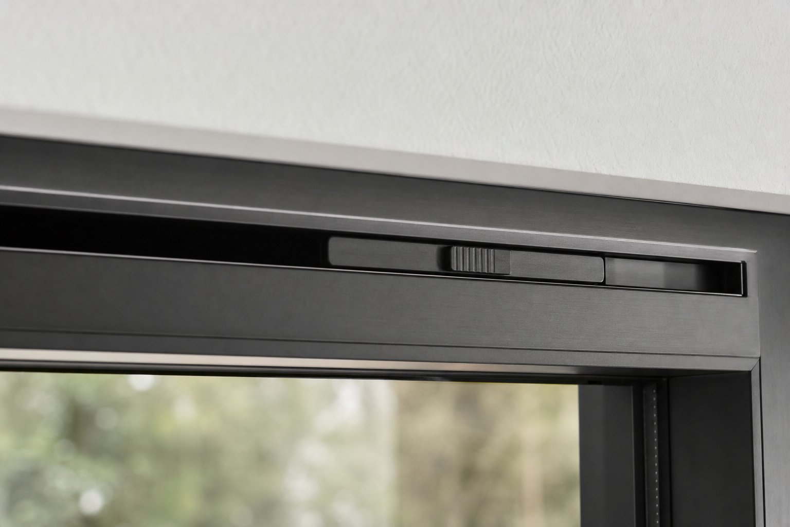 slim trickle vent integrated into the head of a modern aluminium window frame
