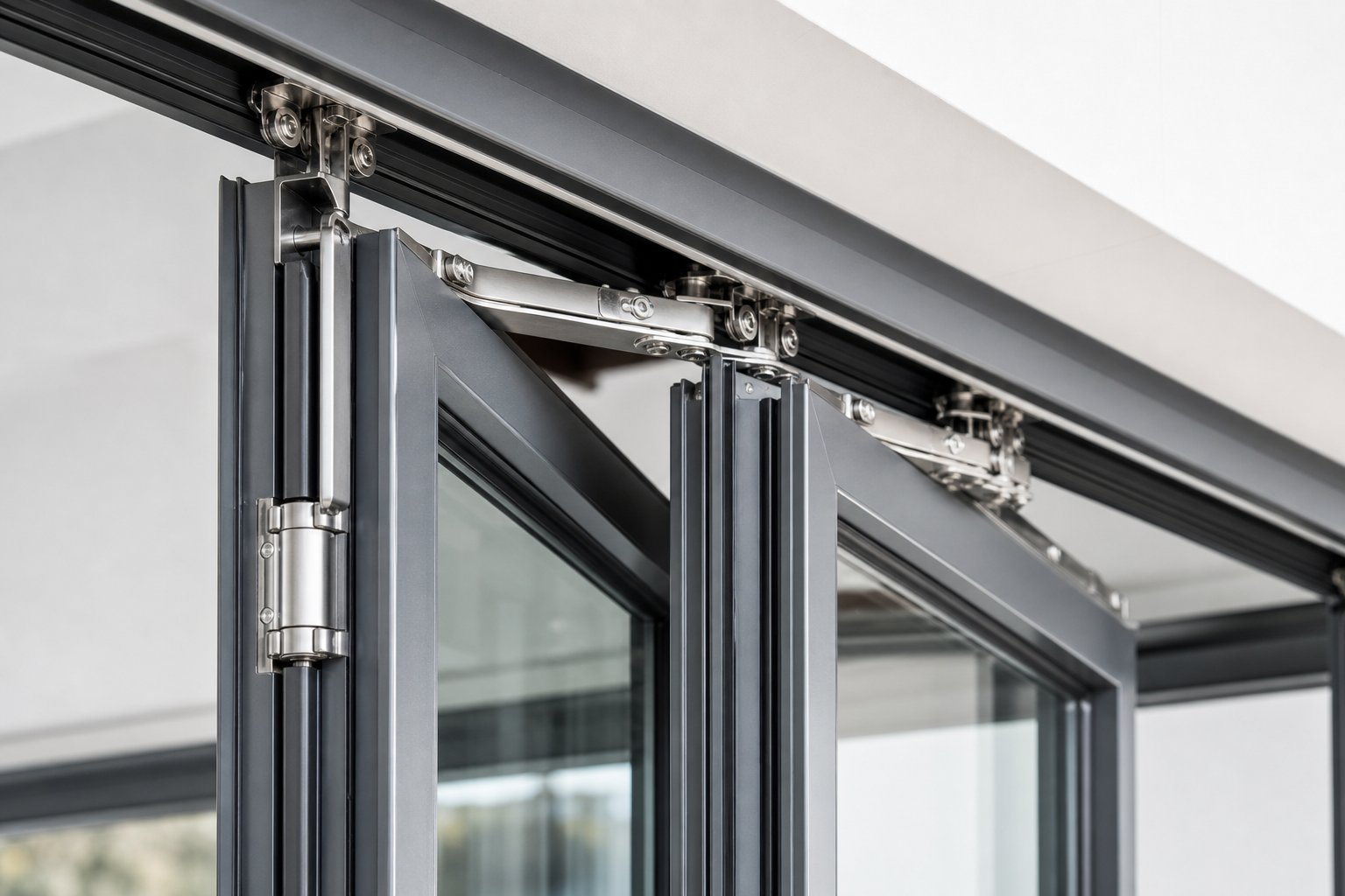 top hung track system and concealed hinges guide folding aluminium window panels through smooth concertina operation