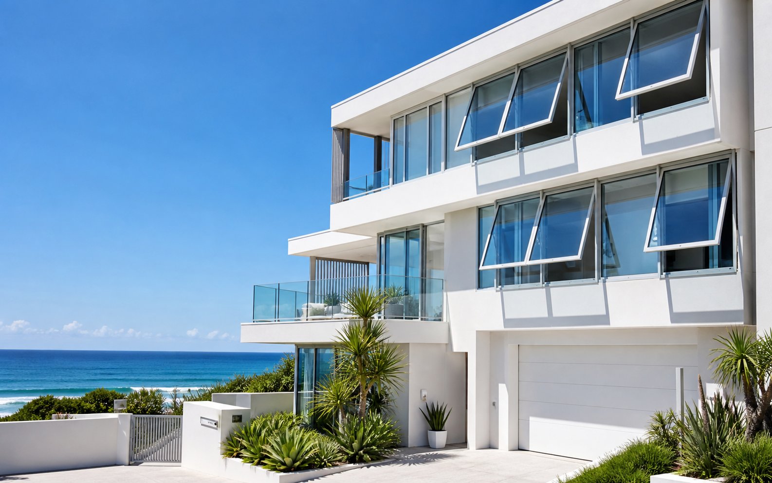 well maintained aluminium awning windows on a coastal australian home holding position against ocean breezes