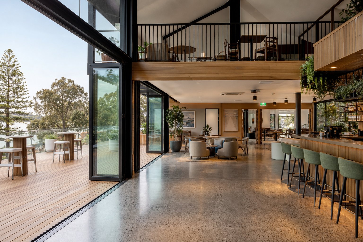 large format aluminium bi fold doors creating seamless indoor outdoor flow in a commercial hospitality setting